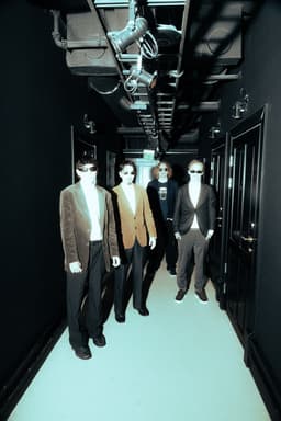 Three Dead Fingers in a hotel corridor