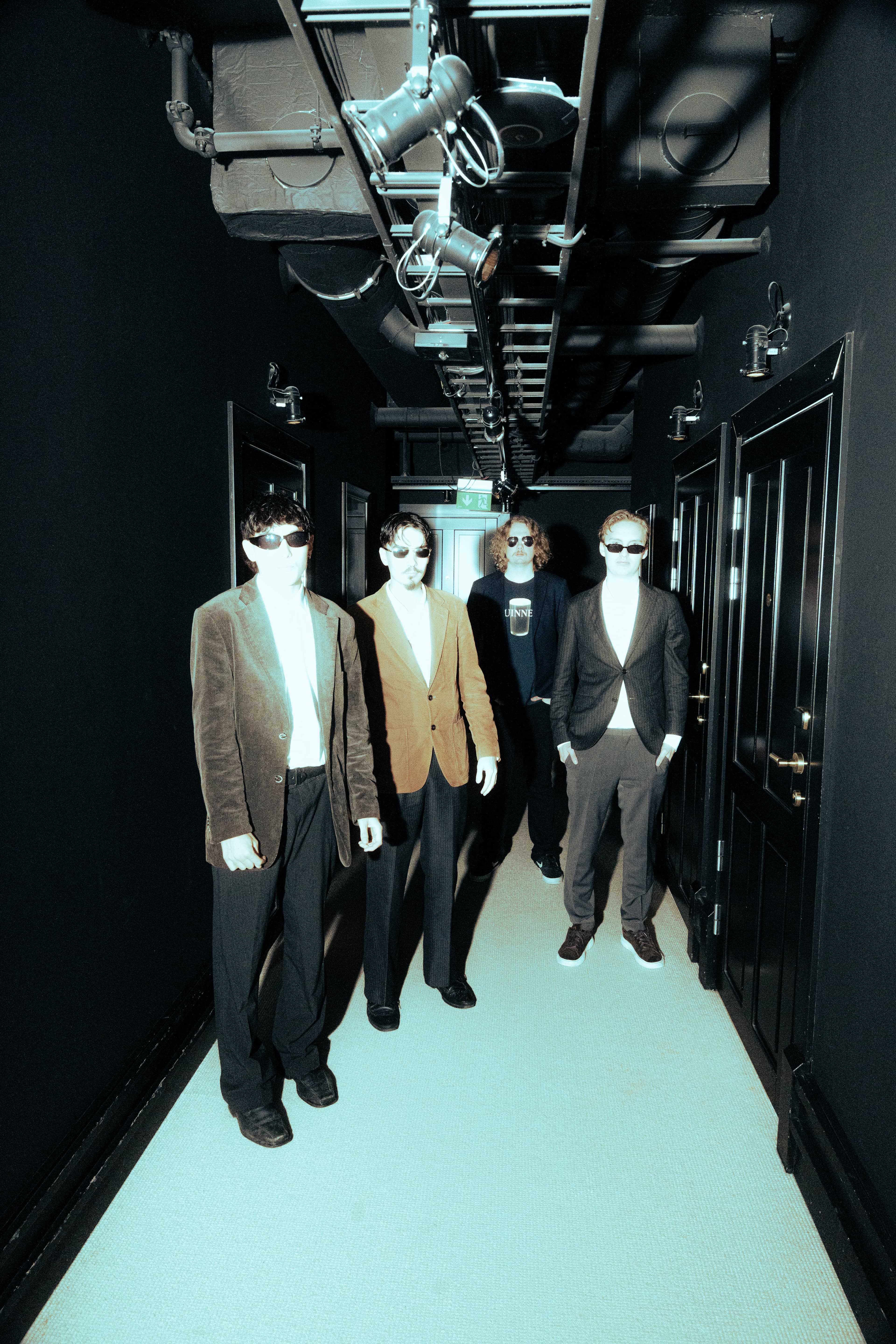Three Dead Fingers in a hotel corridor